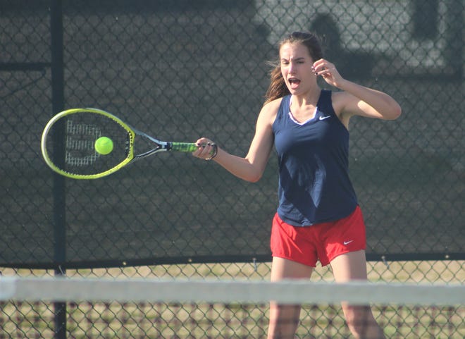 Dinwiddie Girls Tennis player Breanne Gill returns the ball to her Prince George opponent after the first serve is declared out. [Nick Vandeloecht/progress-index.com]