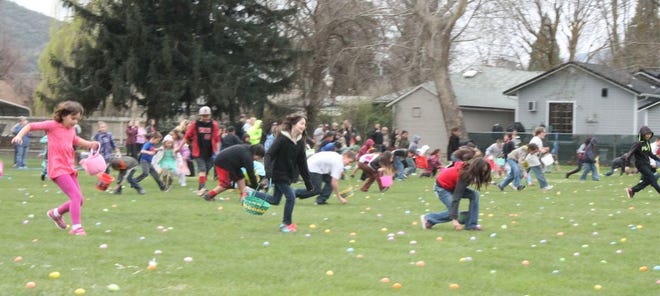 Local kids hunt for Easter eggs at a previous event in Yreka.