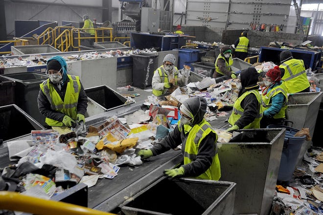 Recyclables at E.L. Harvey Wednesday go through the picking line inside the Material Recycling Facility. [Daily News and Wicked Local Staff Photo/Art Illman]