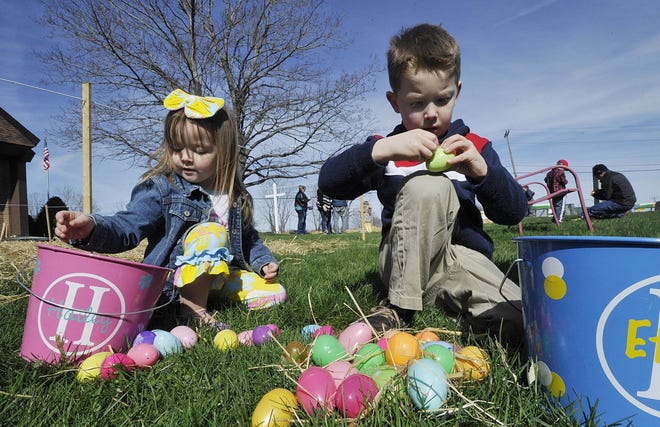 Hailey Medlin, left, then 3, and her brother Ethan, then 6, look inside Easter eggs they found during the seventh annual egg hunt at Asbury United Methodist Church in Millcreek Township on April 8, 2017. [GREG WOHLFORD FILE PHOTO/ERIE TIMES-NEWS]