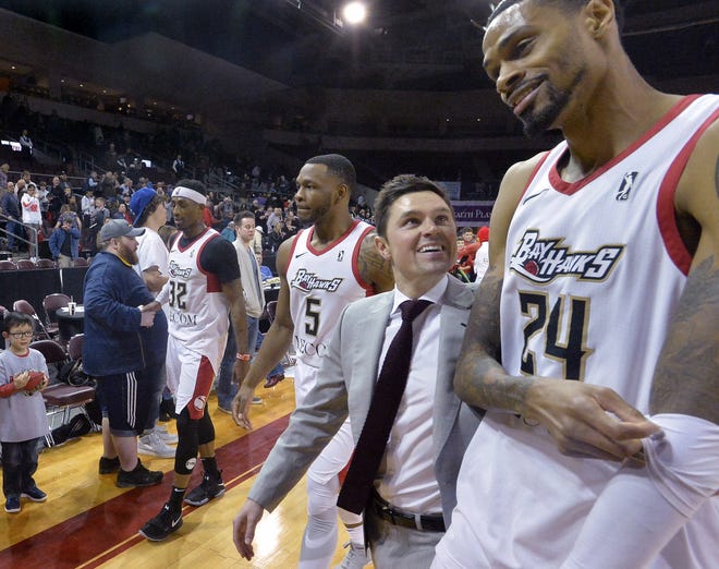 Erie BayHawks, from left, Craig Sword, Tommy Williams, head coach Josh Longstaff and Raphiael Putney leave the floor after defeating the Fort Wayne Mad Ants 113-99 at Erie Insurance Arena in Erie on March 24. Erie hosts Lakeland in a G League playoff game Saturday, March 31. [GREG WOHLFORD/ETN]