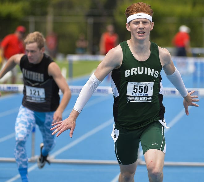 RON JOHNSON/JOURNAL STAR Bret Dannis of Peru St. Bede Academy leaves the field behind as he races to a first place finish in the Class 1A 300-meter intermediate hurdles at the IHSA Boys State track meet on Saturday.