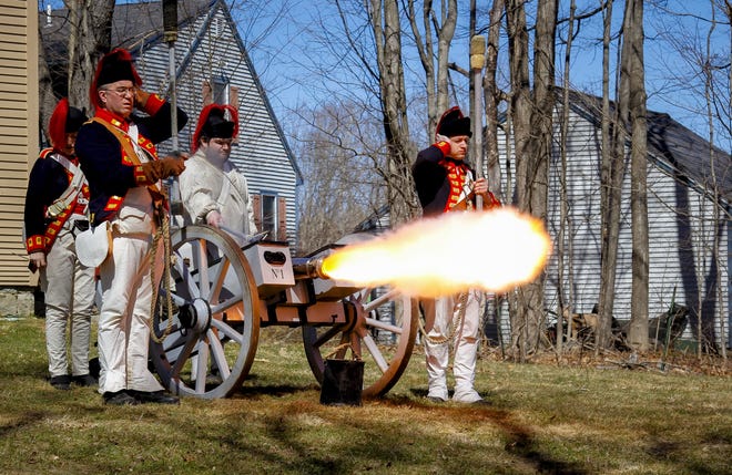 Revolutionary War re-enactors portraying members of His Majesty's Royal Regiment of Artillery shoot a canon at the Colonel Paul Wentworth House Saturday afternoon in Rollinsford. [Shawn St. Hilaire/Fosters.com]