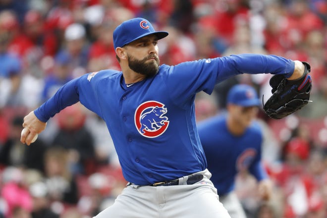 Chicago Cubs starting pitcher Tyler Chatwood throws in the second inning of a baseball game against the Cincinnati Reds, Monday, April 2, 2018, in Cincinnati. (AP Photo/John Minchillo)