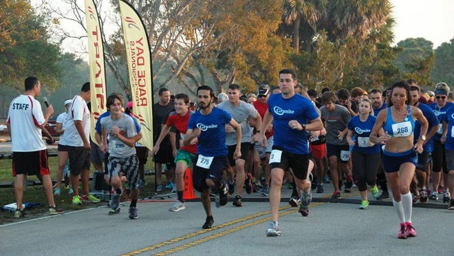 Runners take off from the starting line at the 2017 Heroes 5K at Okeeheelee Park, just east of Wellington. The event benefits the Children’s Home Society of Palm Beach County. (Contributed photo by Ken Clein)