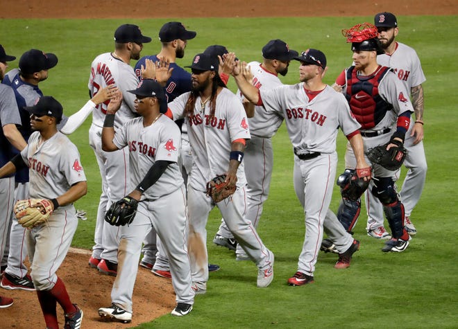 The Red Sox celebrate Monday's win in Miami.