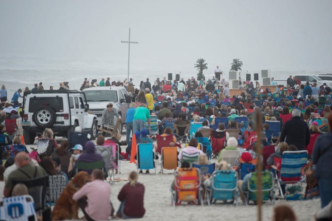 Crescent Beach Baptist Church pastor David Beauchamp leads his church's annual community Easter sunrise service on Crescent Beach on Sunday. The service included a performance by the church's choir and ocean baptisms. [PETER WILLOTT/THE RECORD]