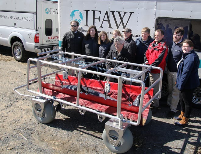 Sturgis Dolphin Rescue Carrier is formally presented by students and faculty of the Sturgis Charter Public School, along with representatives from International Fund for Animal Wellfare (IFAW) and Woods Hole Oceanographic Institution. (BP photo by William F. Pomeroy)