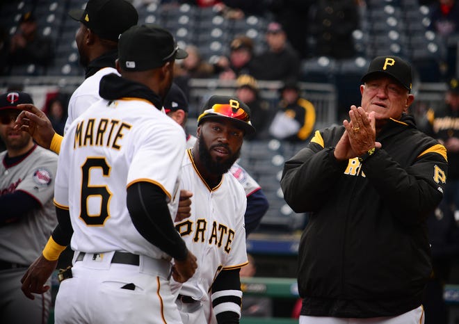 Manager Clint Hurdle, right, and second baseman Josh Harrison greet outfielder Starling Marte after introductions for the Pittsburgh Pirates home opener against the Minnesota Twins Monday at PNC Park. [Lucy Schaly/BCT staff]