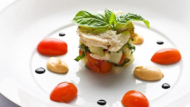 Trevini’s tomato-adorned crab panzanella salad. Photo courtesy Trevini.