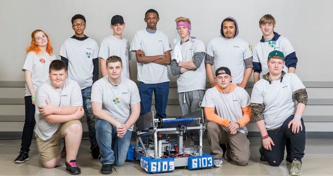 Back row, standing, from left to right: Haylee Brown (lead programmer), Nyan Hall (backup driver), Austin Daigle, Chase Norwood, Michael Songy (lead designer), Javion Johnson, Todd Joffrion (team captain) Front row, kneeling, from left to right: Blaine Smith, Hunter Hutchins (lead driver), Skyler Dozier (build lead), Grant Orcino.(Photo courtesy of Dow Chemical Co.)