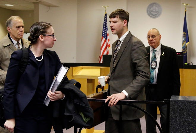 Nathan Carman, second from right, a Vermont man accused by family members of killing his millionaire grandfather and possibly his mother in an attempt to collect inheritance money, prepares to leave district court, Tuesday, April 3, 2018, in Concord, N.H., after a hearing to request more information from him. Carman represented himself after firing his attorneys earlier this year.