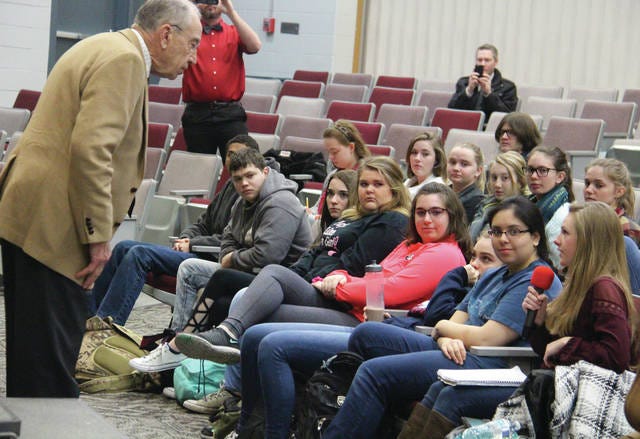 Sen. Chuck Grassley listens to a question asked by senior Paige Harlan during a question and answer session April 4 at the Woodward-Granger High School. PHOTO BY ALLISON ULLMANN/DALLAS COUNTY NEWS