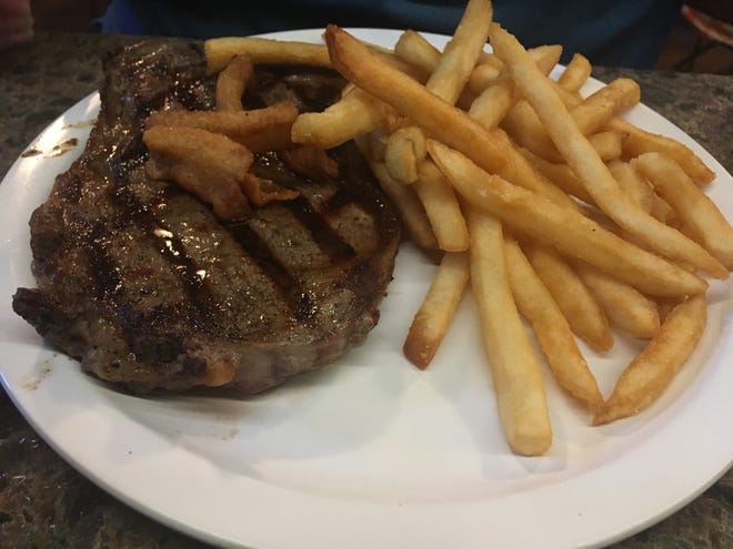 A 9-ounce steak with a side of fries at the Airport Restaurant & Gin Mill [News-Journal/Austin Fuller]