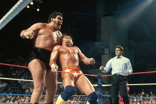 Andre the Giant teaches a lesson to Randy “Macho Man” Savage. [WWE]
