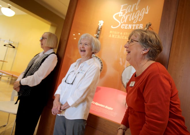 From left, Rachel Cowan, Suzy Buckner and Jean Lankford share memories about their time volunteering at the Earl Scruggs Center on Thursday. [Brittany Randolph/The Star]