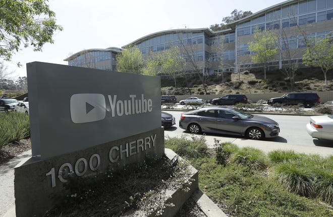 A YouTube sign is shown across the street from the company's offices in San Bruno, Calif., Tuesday. [AP Photo/Jeff Chiu]