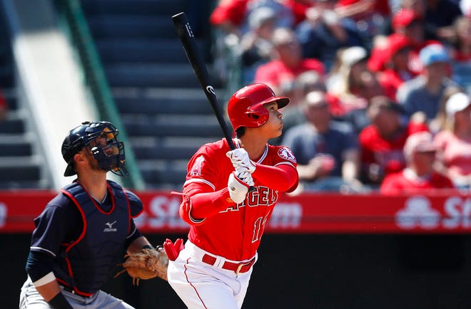 Los Angeles Angels' Shohei Ohtani, of Japan, watches his two-run home run during the fifth inning of a baseball game against the Cleveland Indians on Wednesday, April 4, 2018, in Anaheim, Calif. (AP Photo/Jae C. Hong)