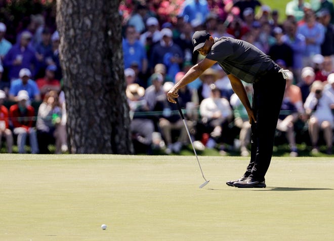 Tiger Woods misses a birdie putt on the 15th hole during the first round at the Masters golf tournament Thursday, April 5, 2018, in Augusta, Ga. (AP Photo/David J. Phillip)