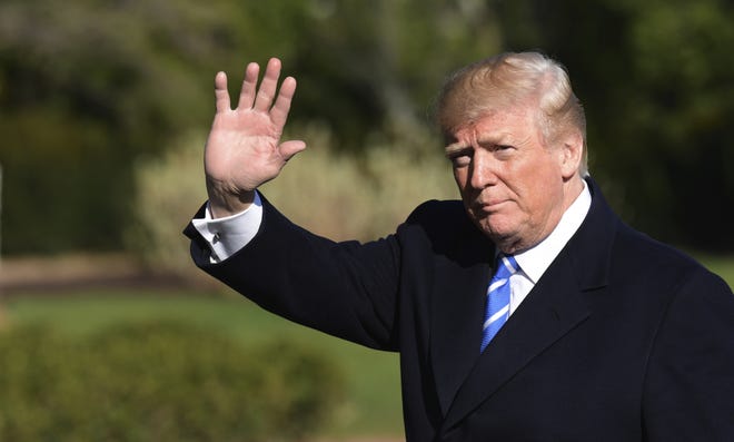 President Donald Trump waves as walks from Marine One on the South Lawn of the White House in Washington, Thursday, April 5, 2018, after returning from a trip to West Virginia. (AP Photo/Susan Walsh)