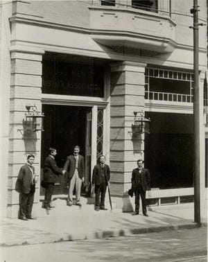 Japanese delegates to the Treaty of Portsmouth conference hang around outside the newly constructed YMCA building on Congress St. in Portsmouth in the summer of 1905. [Courtesy Portsmouth Athenaeum Collection, all rights reserved]