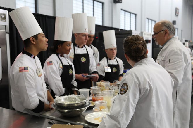 Culinary arts specialists from Fort Bragg receive feedback from American Culinary Federation (ACF) judges March 15 after completing food preparation and prior to cooking during the student team event at the JCTE, at Fort Lee, Va.