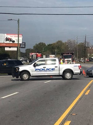 Police and other emergency responders work the scene of a fatal collision on Friday. [Contributed]