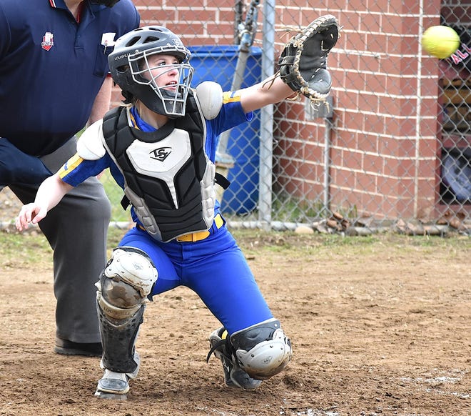 Kaley Steigerwald moves from her crouch to catch a pitch during the fourth inning. Steigerwald singled twice and scored two runs during East Canton's 11-8 win over Tusky Valley.