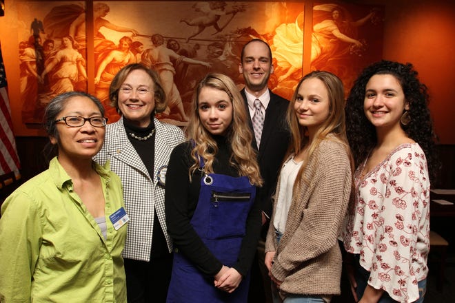 The Rotary Club of Wakefield on Thursday screened "Hooked," an award-winning video documentary by Narragansett High School students. Among those attending were, from left, Wakefield Rotary Club president Pamela Ancheta, member Elizabeth Candas, Narragansett High social studies teacher Mathew Joubert and, front-right, Narragansett student filmmakers Lexie Regan, Anna Lubic and Morgan D'Ambra. [The Providence Journal / Steve Szydlowski]
