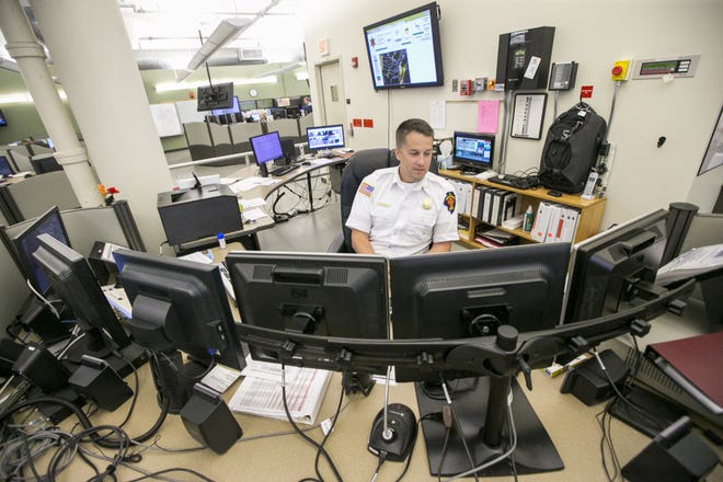John Girone, 911 shift supervisor, keeps an eye on his computer screens on Thursday, June 8, 2017. [ARTURO FERNANDEZ/RRSTAR.COM STAFF]