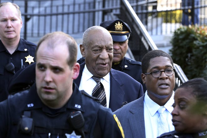 Bill Cosby, center, leaves hearings for jury selection in his sexual assault retrial with spokesperson Andrew Wyatt, second right, Thursday at the Montgomery County Courthouse in Norristown. [Mel Evans/The Associated Press]