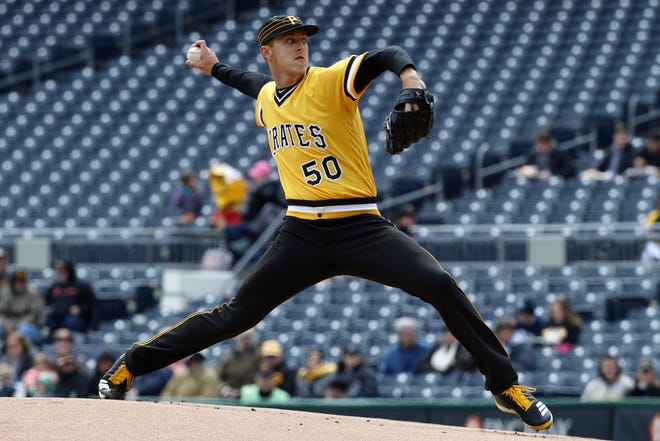 Pirates starting pitcher Jameson Taillon delivers in the first inning Sunday against the Reds in Pittsburgh. [Gene J. Puskar/The Associated Press]