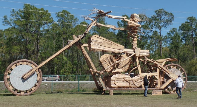This huge wooden bike scupture is erected at the Volusia County Fairgrounds. At the end of bike week crowds gather to watch it burn. [DONNA KESSLER/Times Herald-Record]