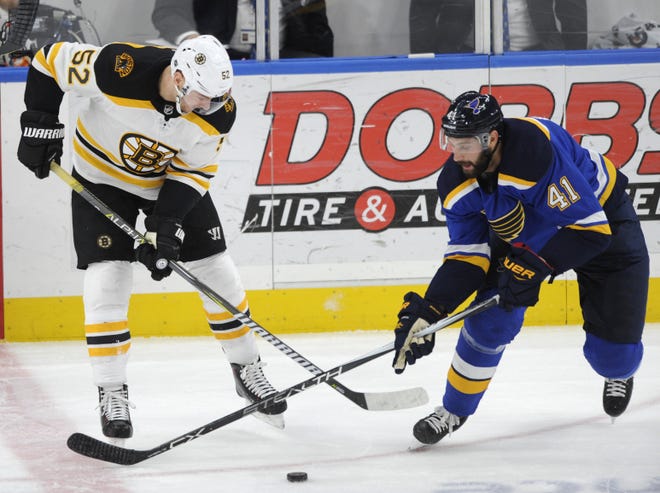 Bruins rookie center Sean Kuraly, shown battling for the puck with St. Louis' Robert Bortuzzo, is looking forward to getting back on the ice for the playoffs after being out of action since March 27 with an injury. [BILL BOYCE/THE ASSOCIATED PRESS]