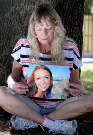 Christie Bartleson holds a photo of her daughter Jane Bartleson, 25, who died in a car wreck in November 2017 in Destin. [NICK TOMECEK/DAILY NEWS]