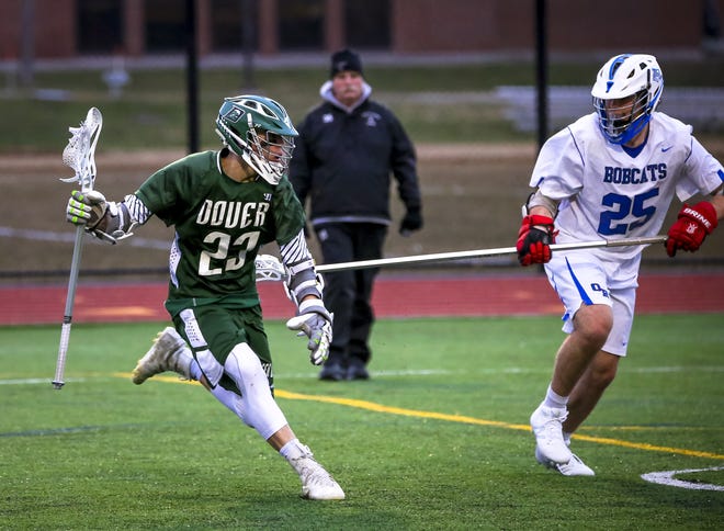 Dominic Silveriro, left, and the Dover boys lacrosse team will once agains be among the favorites in Division II this spring. [Shawn St. Hilaire/Fosters.com]