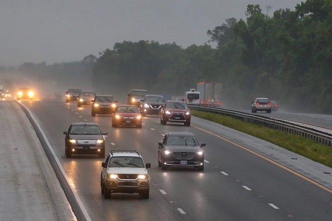 Rain continues to fall in north central Florida Tuesday after very heavy precipitation overnight. Here cars travel north through rain on Interstate 75 in Ocala.