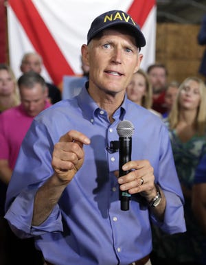 Florida Gov. Rick Scott announced his bid to run for the U.S. Senate at a news conference on Monday in Orlando. [AP Photo / John Raoux]