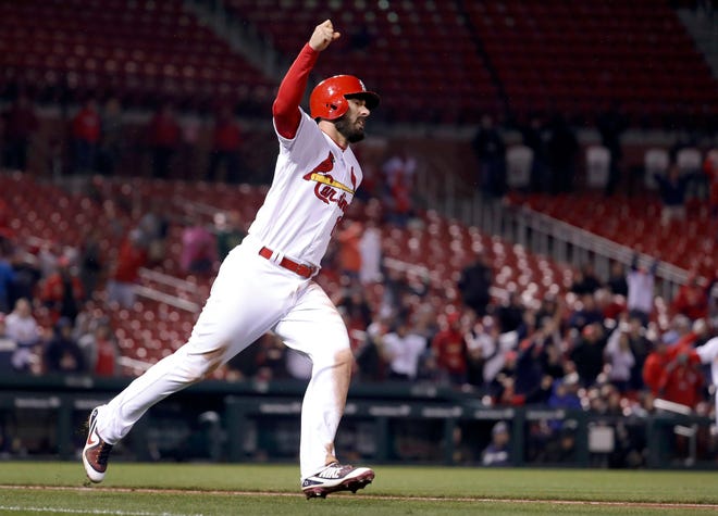 St. Louis Cardinals' Matt Carpenter celebrates after hitting a walk-off home run during the 11th inning of the team's baseball game against the Milwaukee Brewers on Tuesday, April 10, 2018, in St. Louis. The Cardinals won 5-3. (AP Photo/Jeff Roberson)