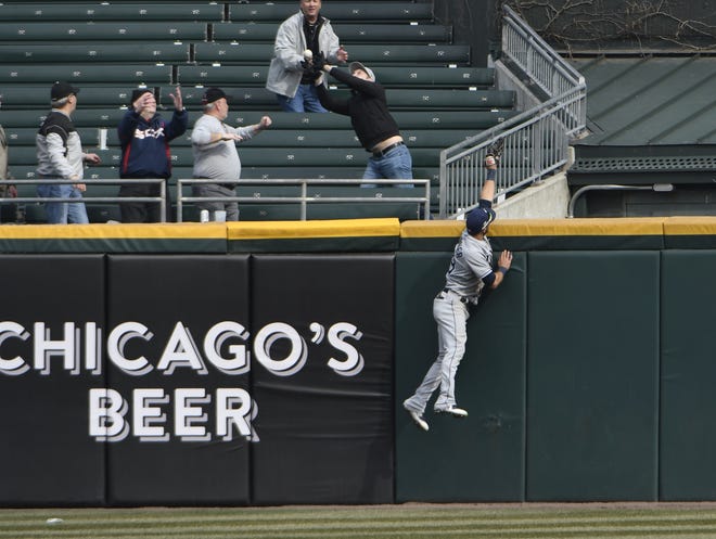Tampa Bay Rays center fielder Kevin Kiermaier tries to catch a two-run home run hit by Chicago White Sox designated hitter Matt Davidson during the eighth inning Wednesday in Chicago. The White Sox won 2-1. [The Associated Press / David Banks]