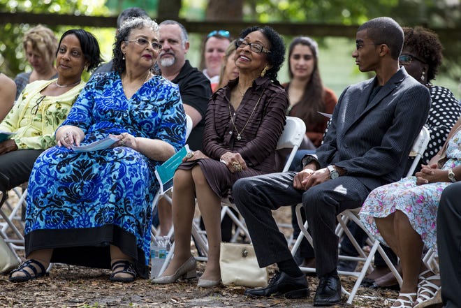 Lakay Banks, center, wife of the late Dr. Cullen Banks, smiles as she is introduced before her speech Saturday during the open house for the refurbished offices of Dr. Banks and Dr. Edgar Allen Cosby to create the Dr. Banks & Dr. Cosby Youth Empowerment Center.

[Lauren Bacho/Special to the Guardian]