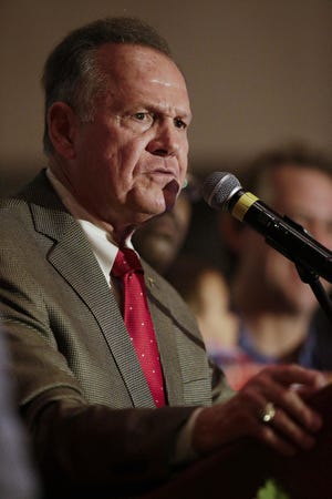 Roy Moore is countersuing a woman who said he sexually touched her when she was 14 and he was 32. [File/AP]