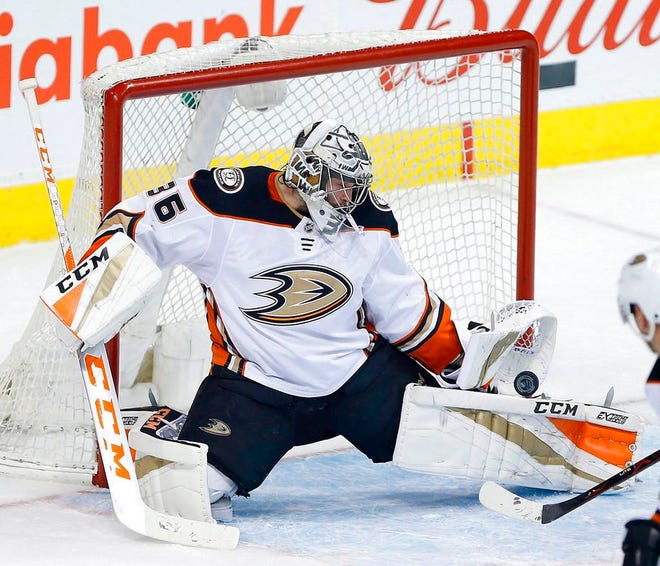 Anaheim Ducks goaltender John Gibson (36) makes a save against the Winnipeg Jets during the first period of an NHL hockey game in Winnipeg, Manitoba. The Ducks face the San Jose Sharks in the first round of the Stanley Cup playoffs. (John Woods/The Canadian Press via AP, File)