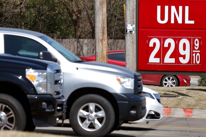 Cars pass a gas station in Oklahoma City on Thursday. [Photos by Bryan Terry, The Oklahoman]