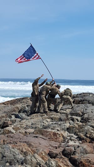 A re-enactment of the Flag Raising on Iwo Jima during Patriots Day in Ogunquit.

[Jennifer Bryant, file photo]