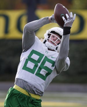 Oregon wide receiver Brenden Schooler hauls in a pass during practice October 10 in Eugene. (Andy Nelson/The Register-Guard)