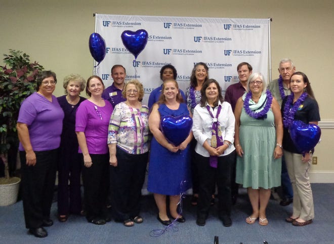University of Florida Extension employees wear purple during a previous Purple Up! day. The color represents the blending of Army green, Marine red, and Coast Guard, Air Force and Navy blue. [CONTRIBUTED PhOTO]