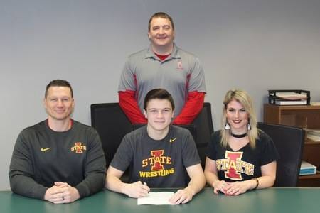 Zane Mulder signing his letter of intent to wrestle for Iowa State University next season. PHOTO SUBMITTED TO DCN