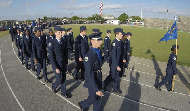 Choctawhatchee High School's Air Force Junior ROTC unit marches at Etheredge Stadium on Friday during its annual Pass In Review.

[DEVON RAVINE/DAILY NEWS]