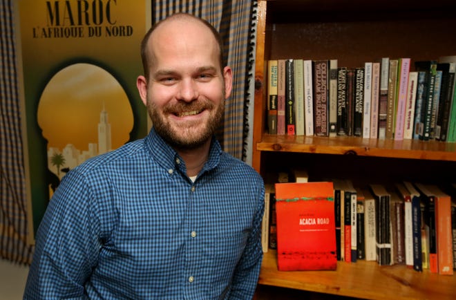 Author Aaron Brown wrote the book 'Acacia Road,' a book of poetry about his life so far from his early beginnings as a child of missionaries living in Chad to his adult life finding out where home is. [Sandra J. Milburn/HutchNews]
